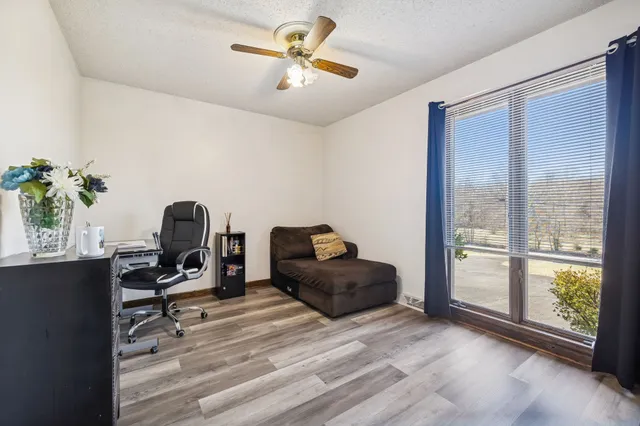 a workspace with furniture and a window