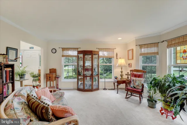 a bed room with furniture and a window
