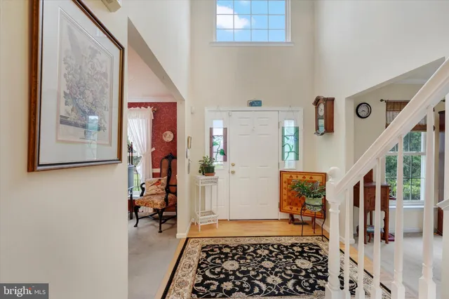 a view of entryway with furniture and rug
