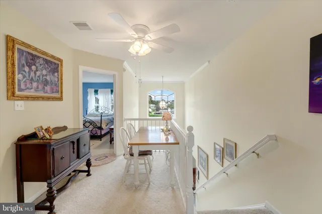 a workspace with furniture and chandelier