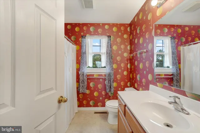 a bathroom with a sink a vanity and a mirror