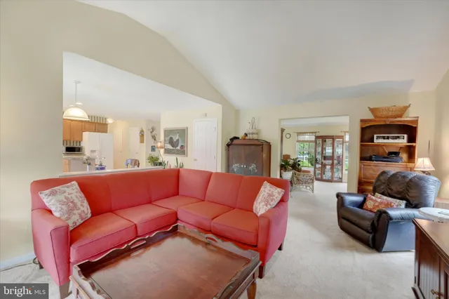 a living room with furniture a couch and a fireplace