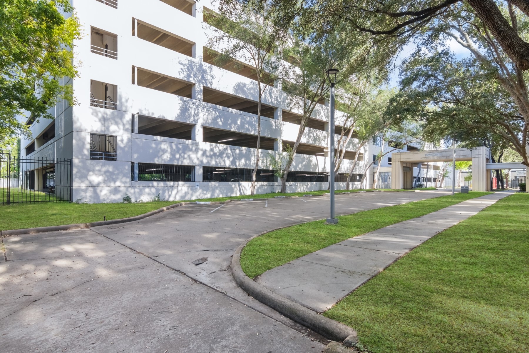 9800 Centre Parkway, Unit 1003 Houston, TX 77036 - Photo 27 of 29 a view of a building with a yard