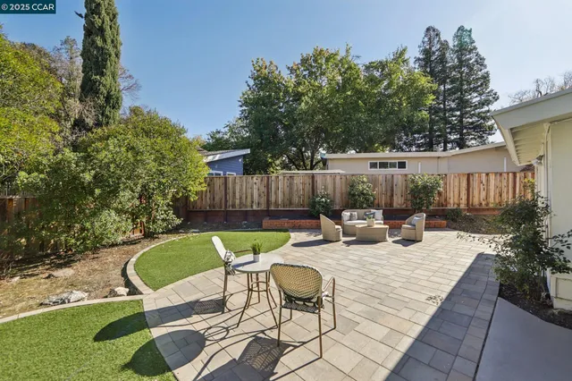 a view of a chair and table in the patio
