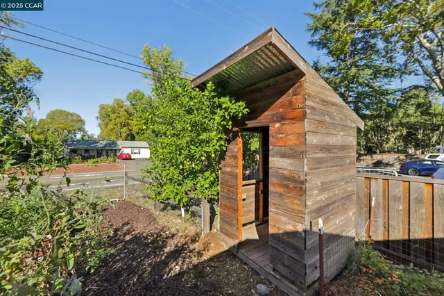 a backyard of a house with lots of green space