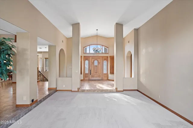 a kitchen with stainless steel appliances granite countertop a sink stove and wooden cabinets