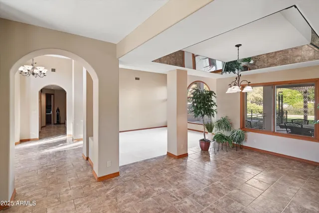 a kitchen with a sink and large window