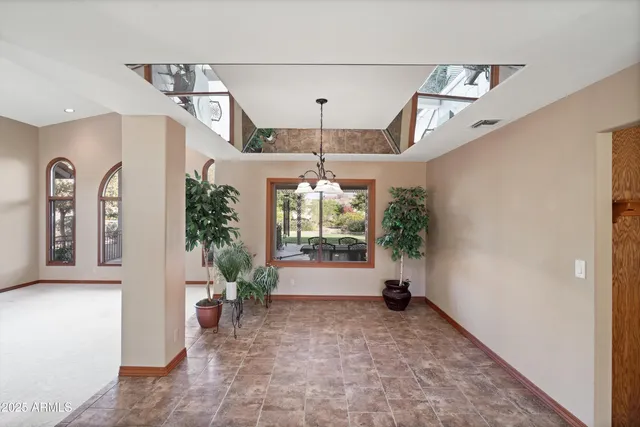 a kitchen with stainless steel appliances a refrigerator sink and microwave
