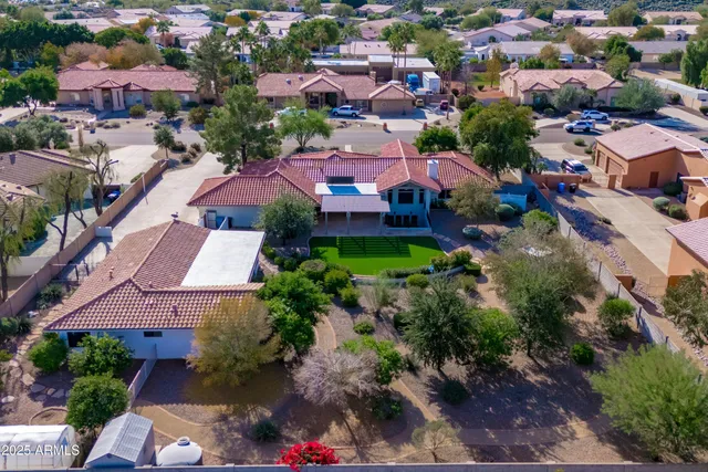 an aerial view of residential houses and outdoor space