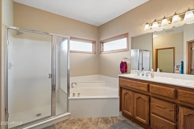 a bathroom with a sink a bathtub and a shower