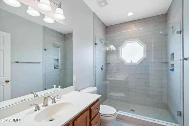 a living room with furniture kitchen view and a window