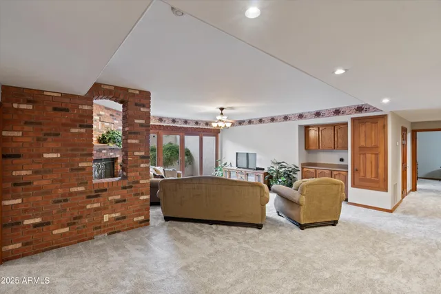 a view of a house with a porch and furniture