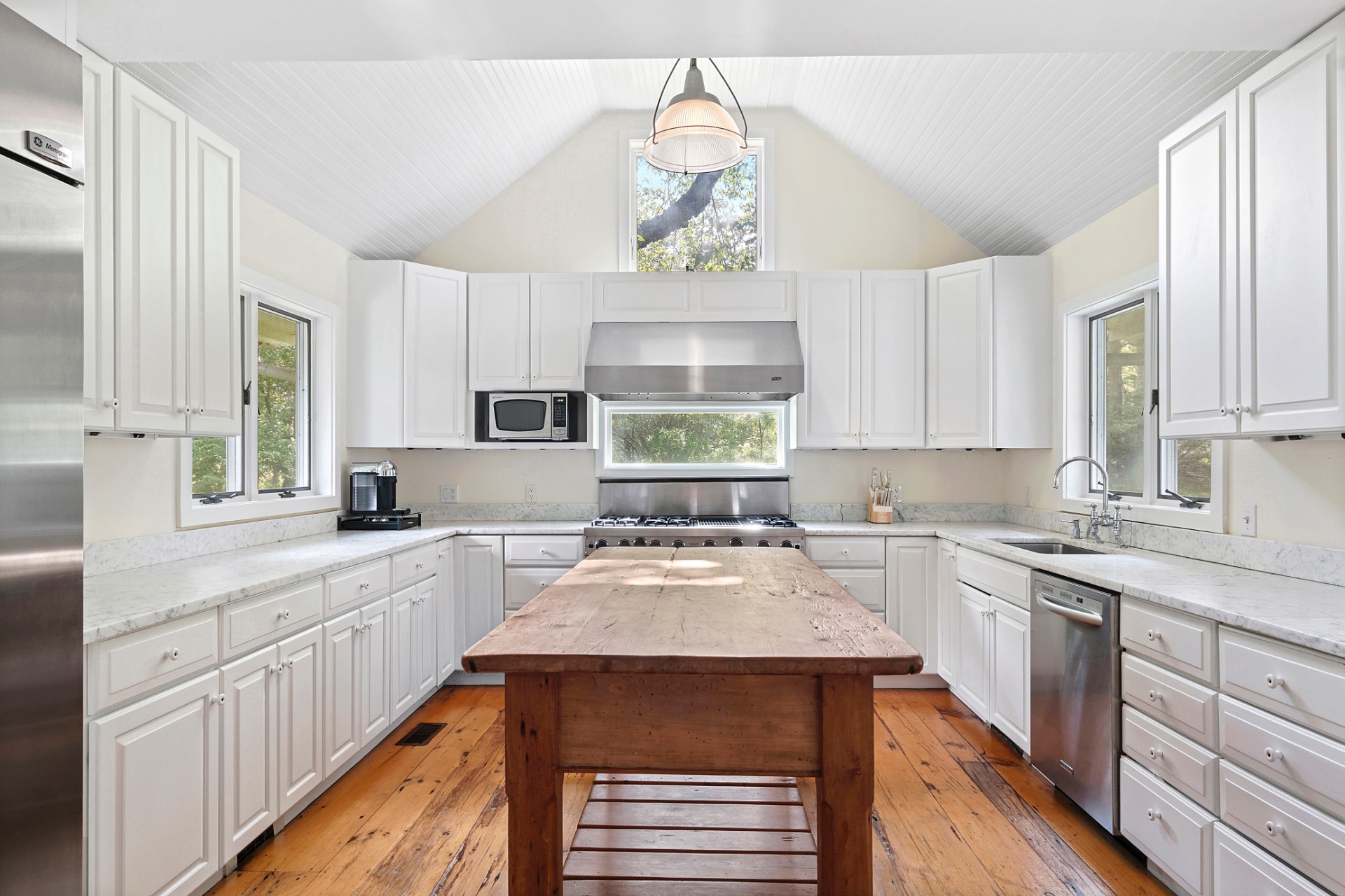 28 Deer Ridge Trail Water Mill, NY 11976 - Photo 10 of 23 a kitchen with a sink stove and cabinets