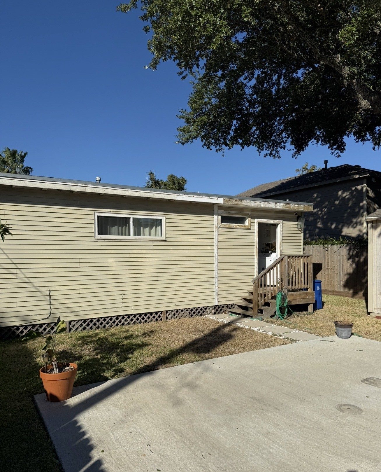 1406 Kirwin Street Galveston, TX 77551 - Photo 13 of 13 front view of a house with a patio