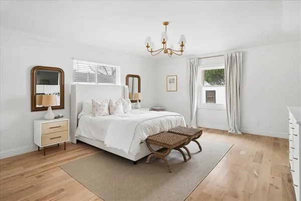 a bedroom with bed and a window