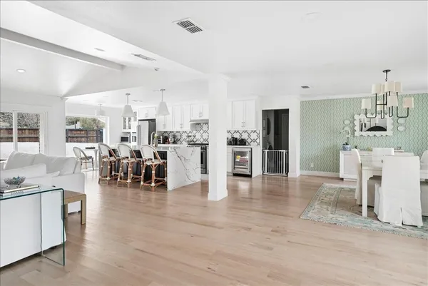 a view of a living room kitchen and dining room