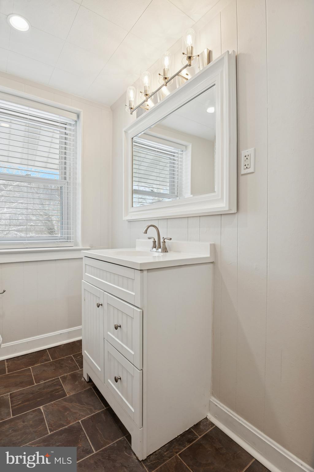 3 South Brandywine Avenue, Unit 3RD 6 Modena, PA 19320 - Photo 18 of 29 a bathroom with a sink a mirror and a vanity