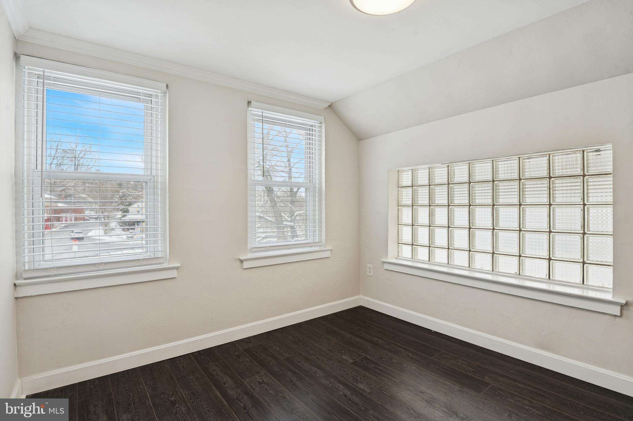 3 South Brandywine Avenue, Unit 3RD 6 Modena, PA 19320 - Photo 9 of 29 a view of an empty room with wooden floor and a window