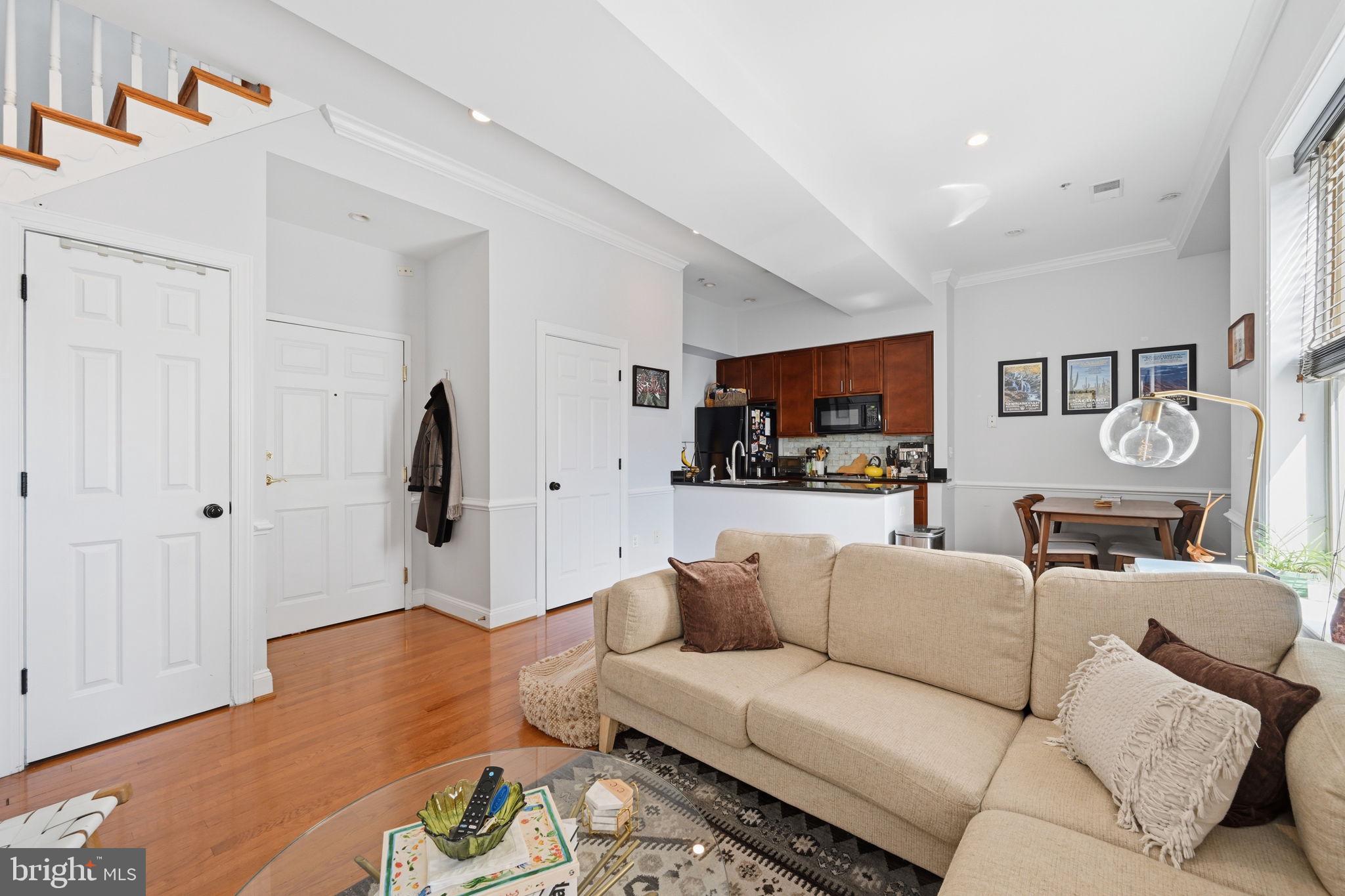 1229 12th Street Northwest, Unit 208 Washington, DC 20005 - Photo 13 of 35 a living room with furniture and a wooden floor