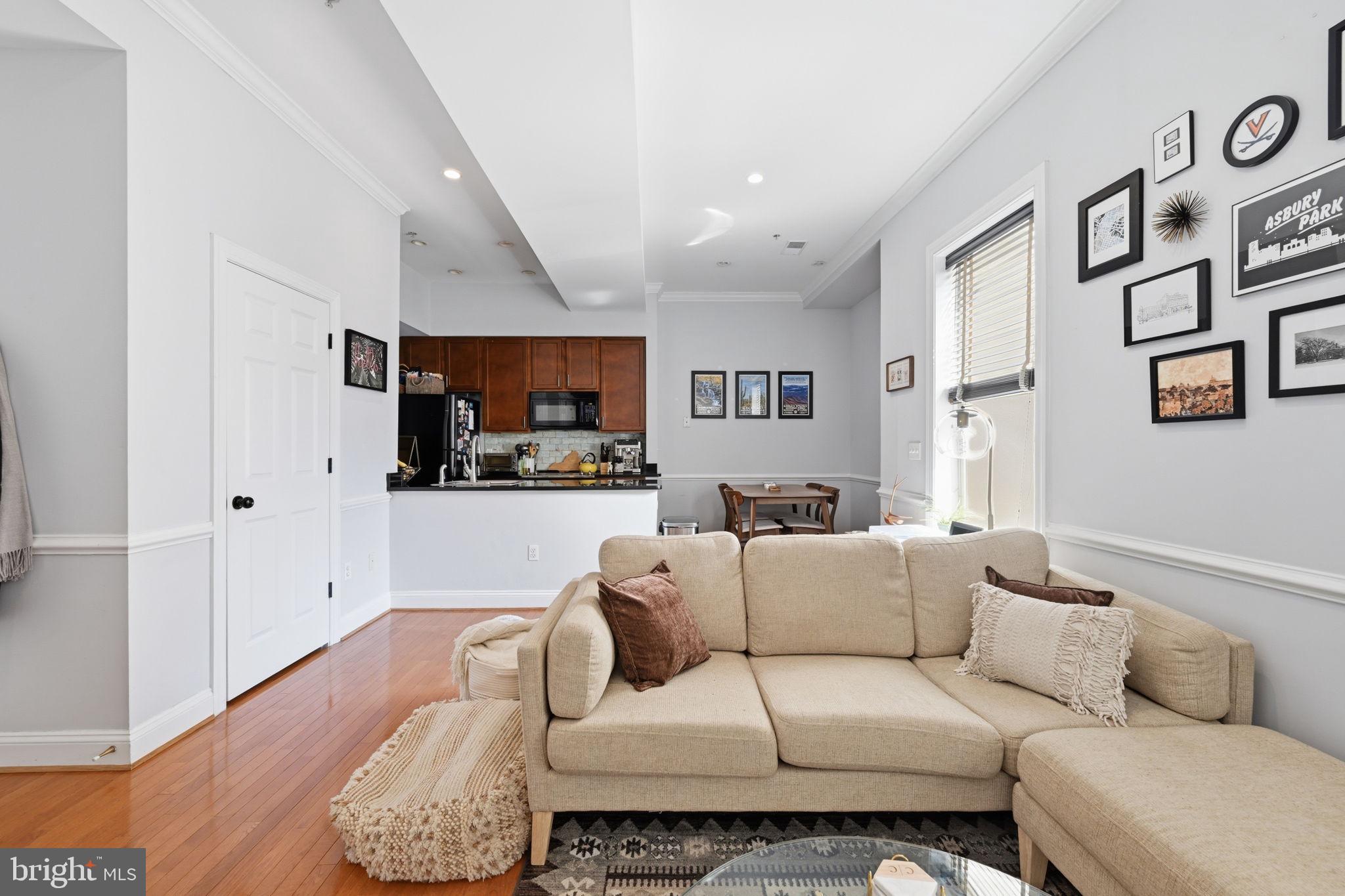 1229 12th Street Northwest, Unit 208 Washington, DC 20005 - Photo 14 of 35 a living room with furniture and kitchen view