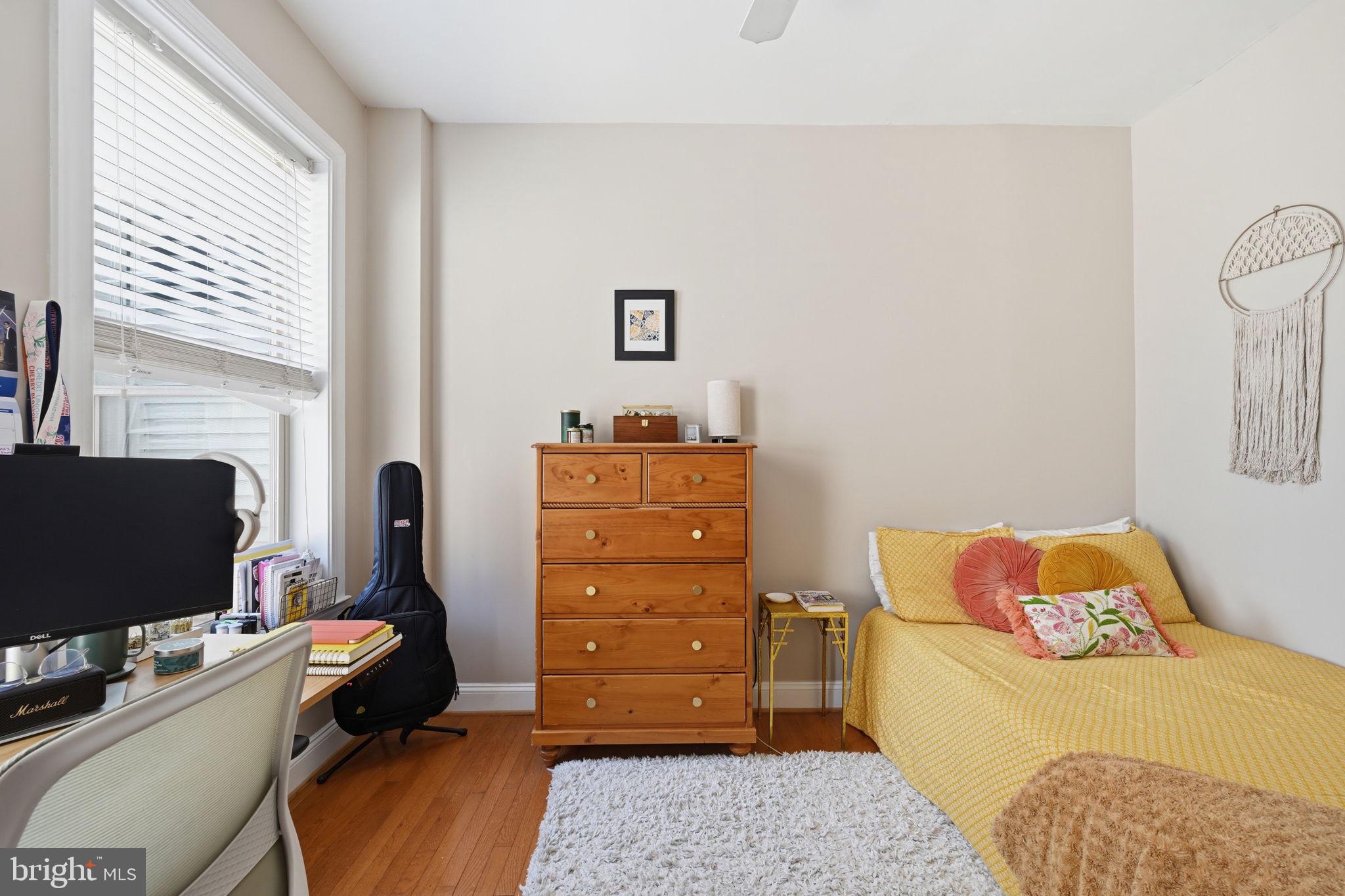 1229 12th Street Northwest, Unit 208 Washington, DC 20005 - Photo 21 of 35 a bedroom with a bed and flat screen tv