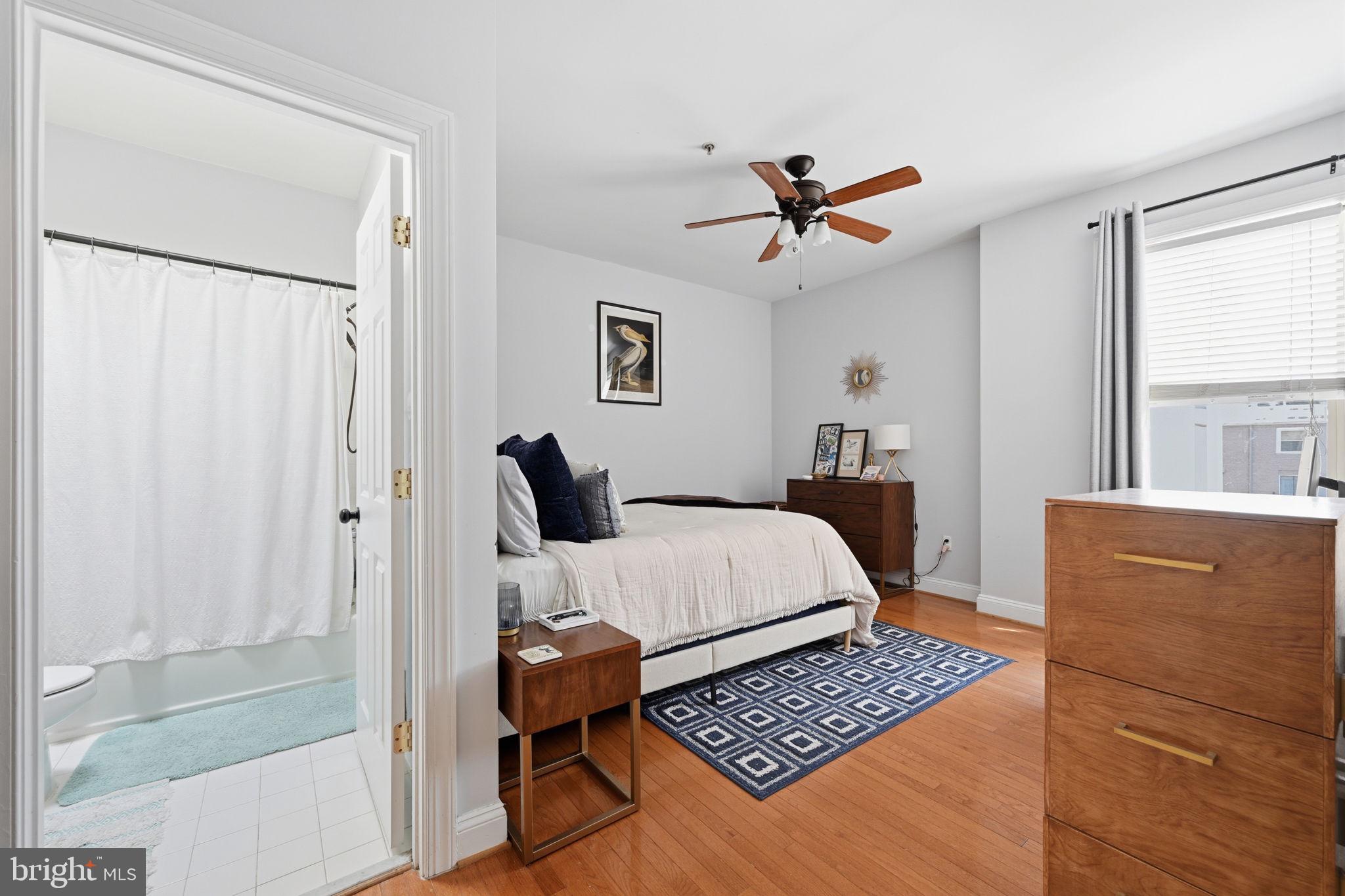 1229 12th Street Northwest, Unit 208 Washington, DC 20005 - Photo 22 of 35 a bedroom with a bed and a window