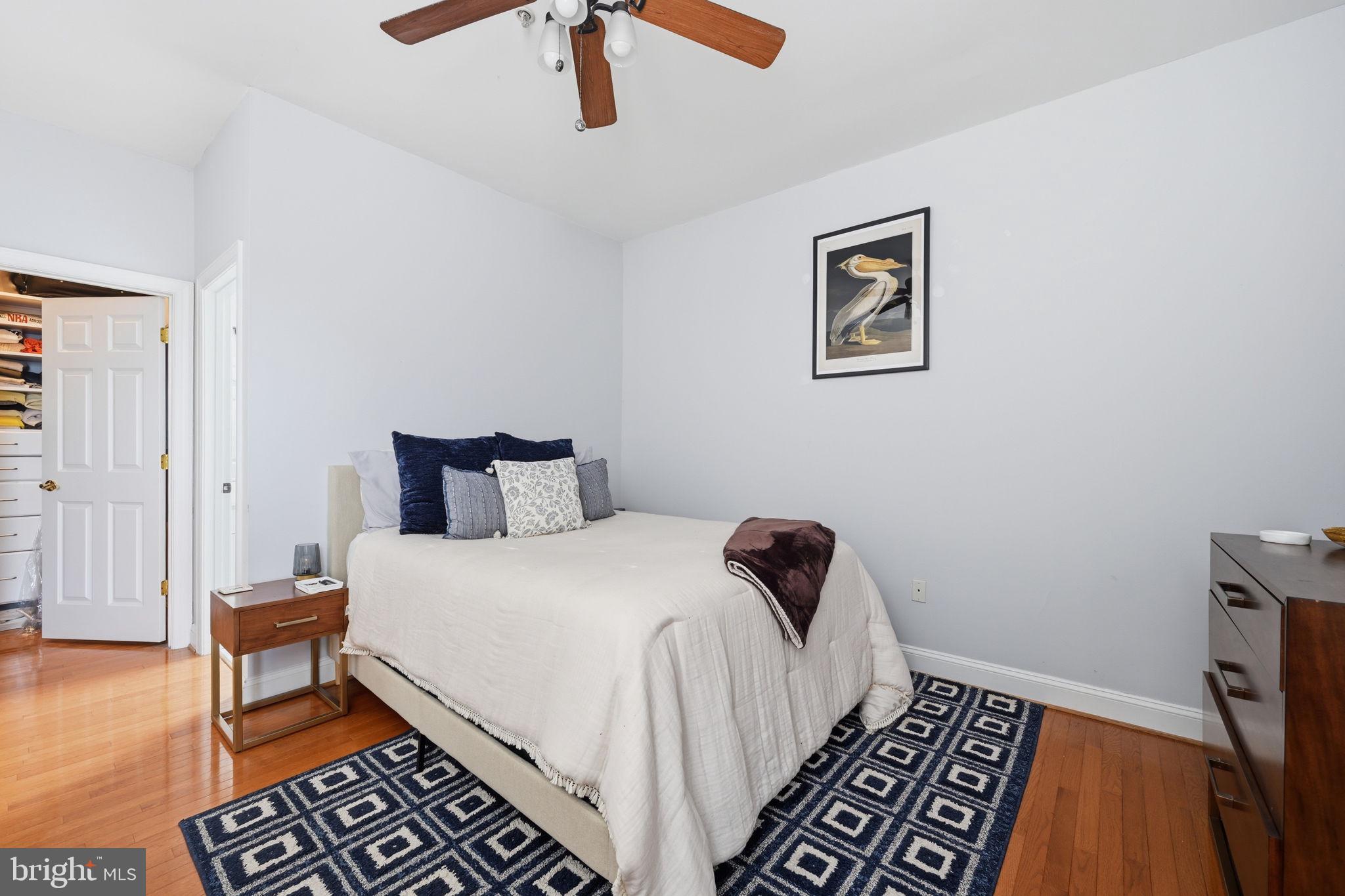 1229 12th Street Northwest, Unit 208 Washington, DC 20005 - Photo 23 of 35 a bedroom with a bed and wooden floor