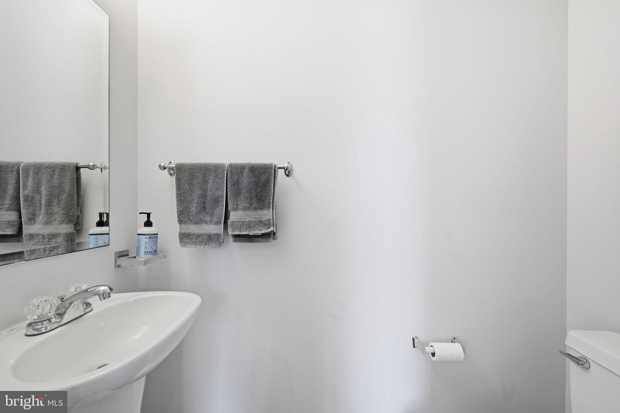 1229 12th Street Northwest, Unit 208 Washington, DC 20005 - Photo 27 of 35 a bathroom with a sink and a mirror