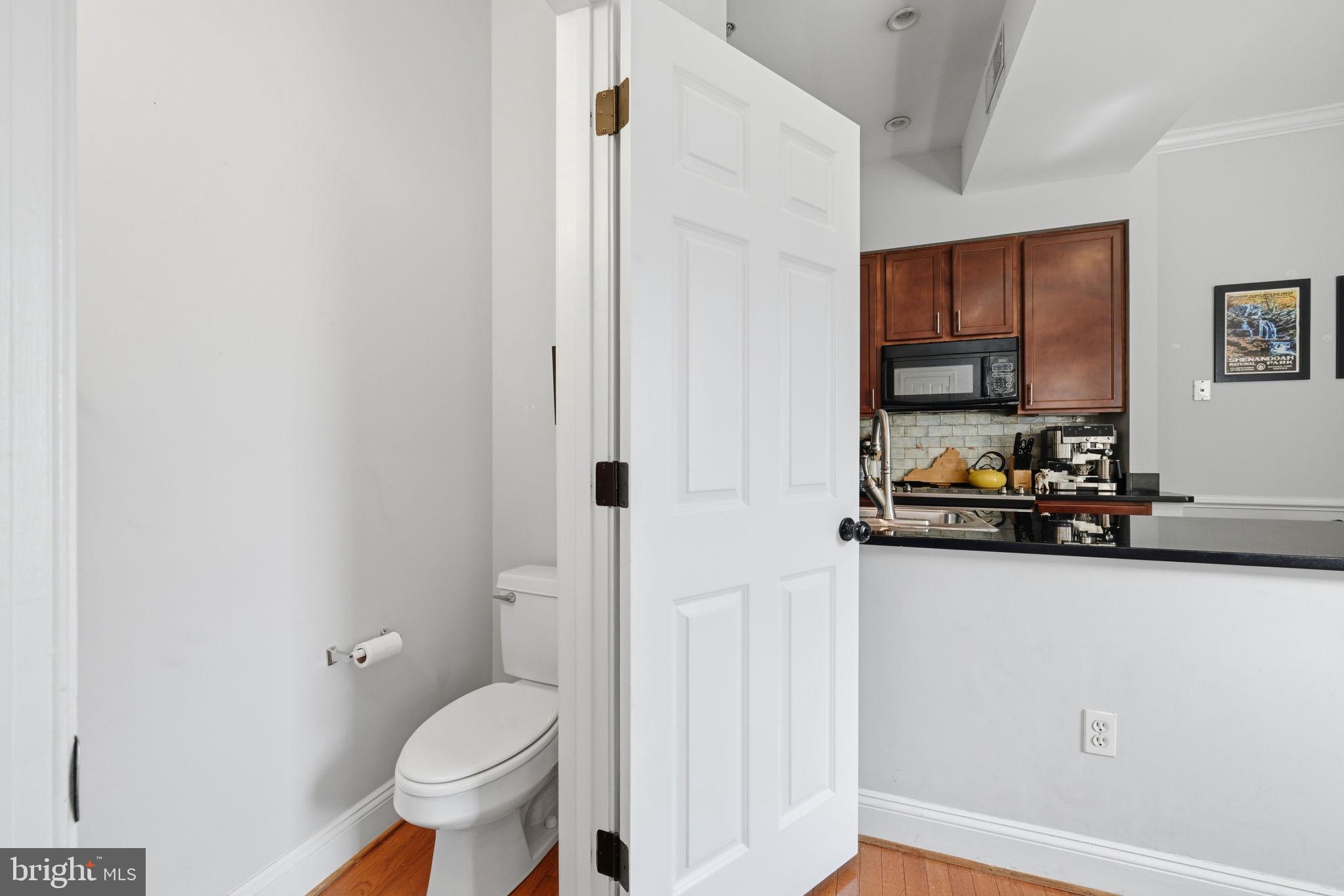 1229 12th Street Northwest, Unit 208 Washington, DC 20005 - Photo 28 of 35 a bathroom with a sink toilet and shower