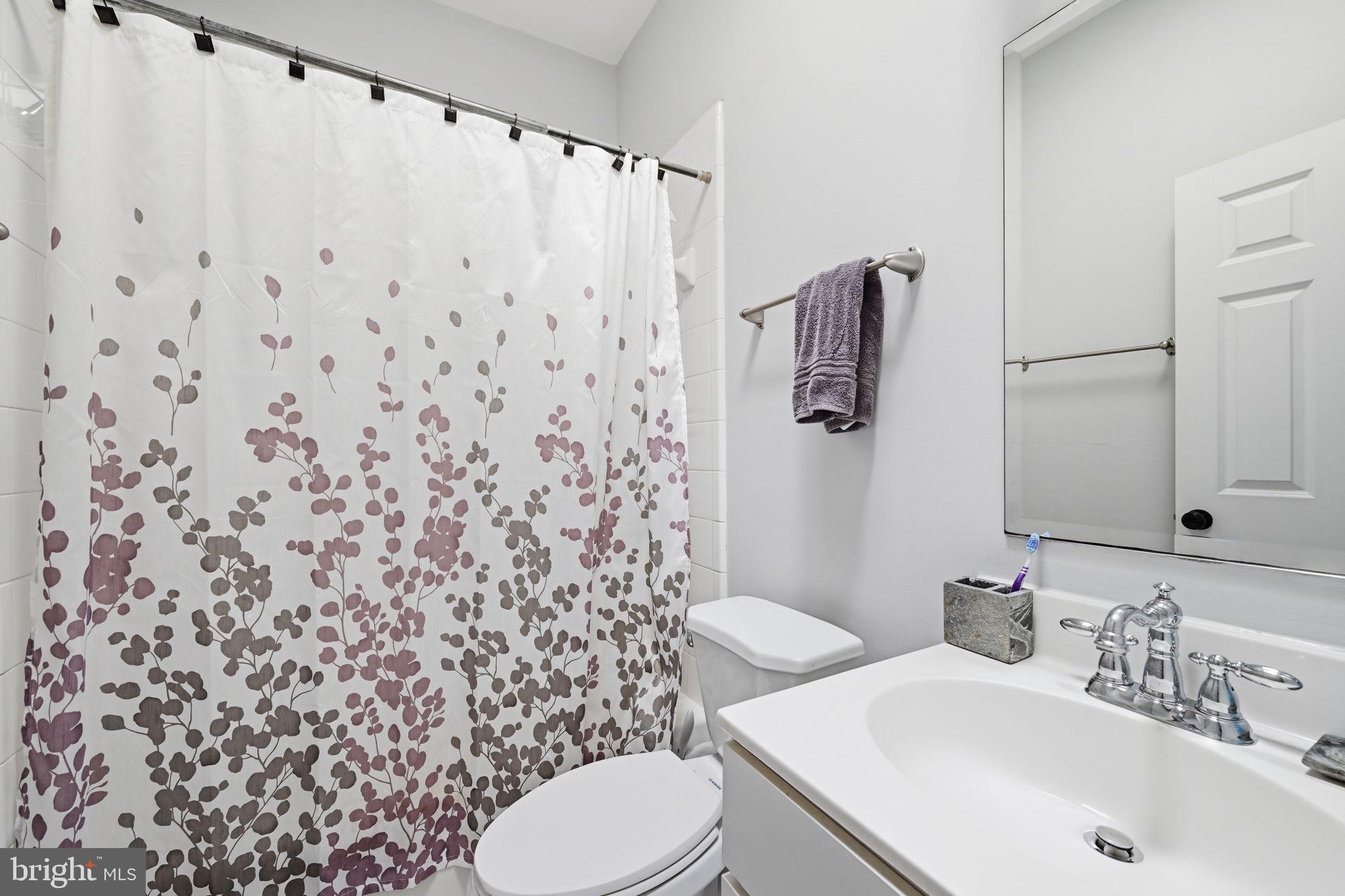 1229 12th Street Northwest, Unit 208 Washington, DC 20005 - Photo 30 of 35 a bathroom with a sink toilet and shower