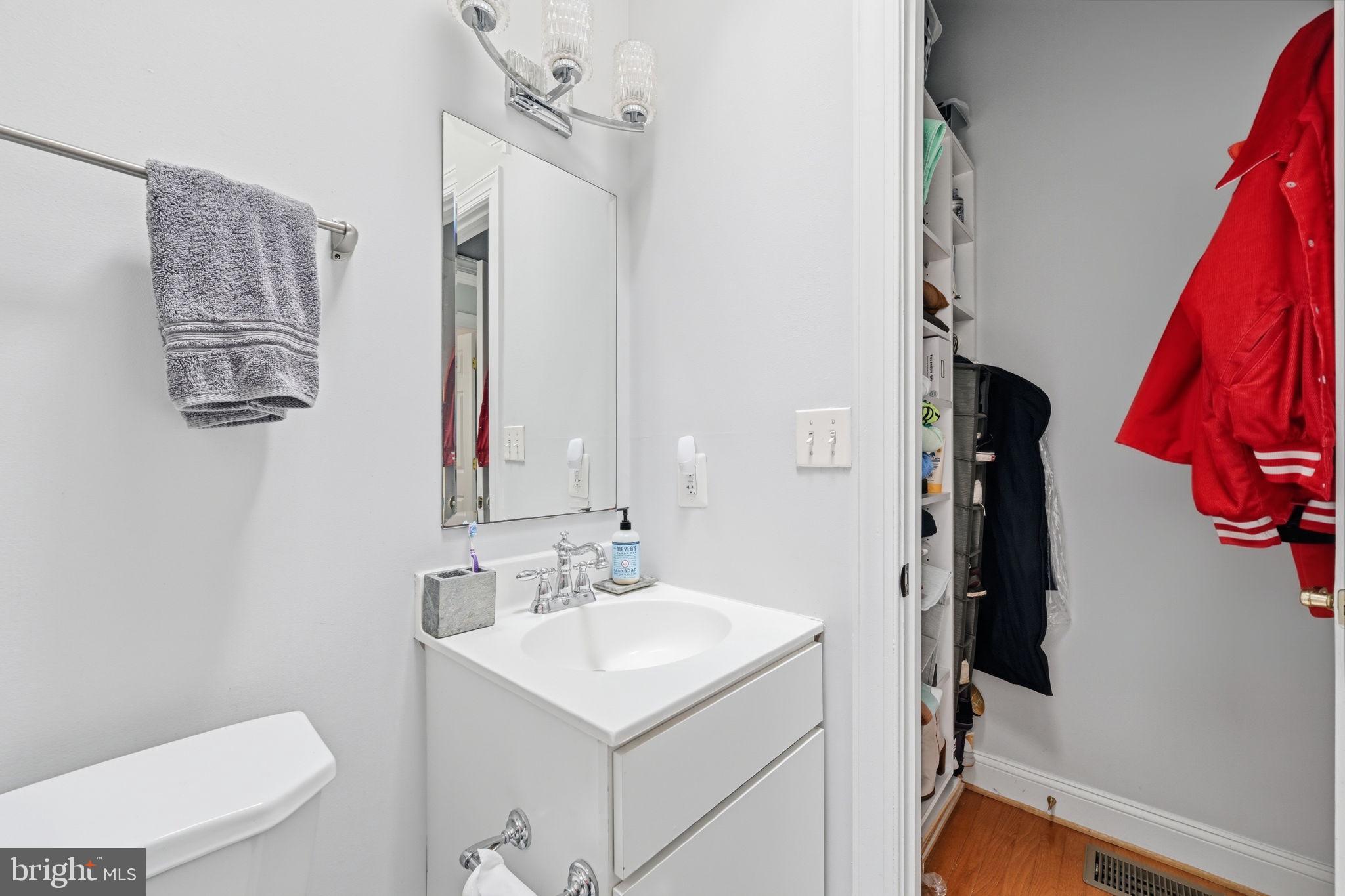 1229 12th Street Northwest, Unit 208 Washington, DC 20005 - Photo 31 of 35 a bathroom with a sink vanity mirror and toilet