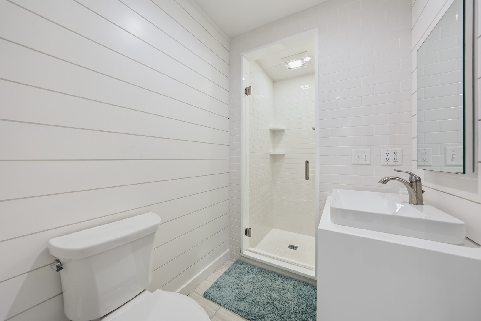 10 Pilgrim Road Nantucket, MA 02554 - Photo 53 of 65 a bathroom with a sink a toilet and shower