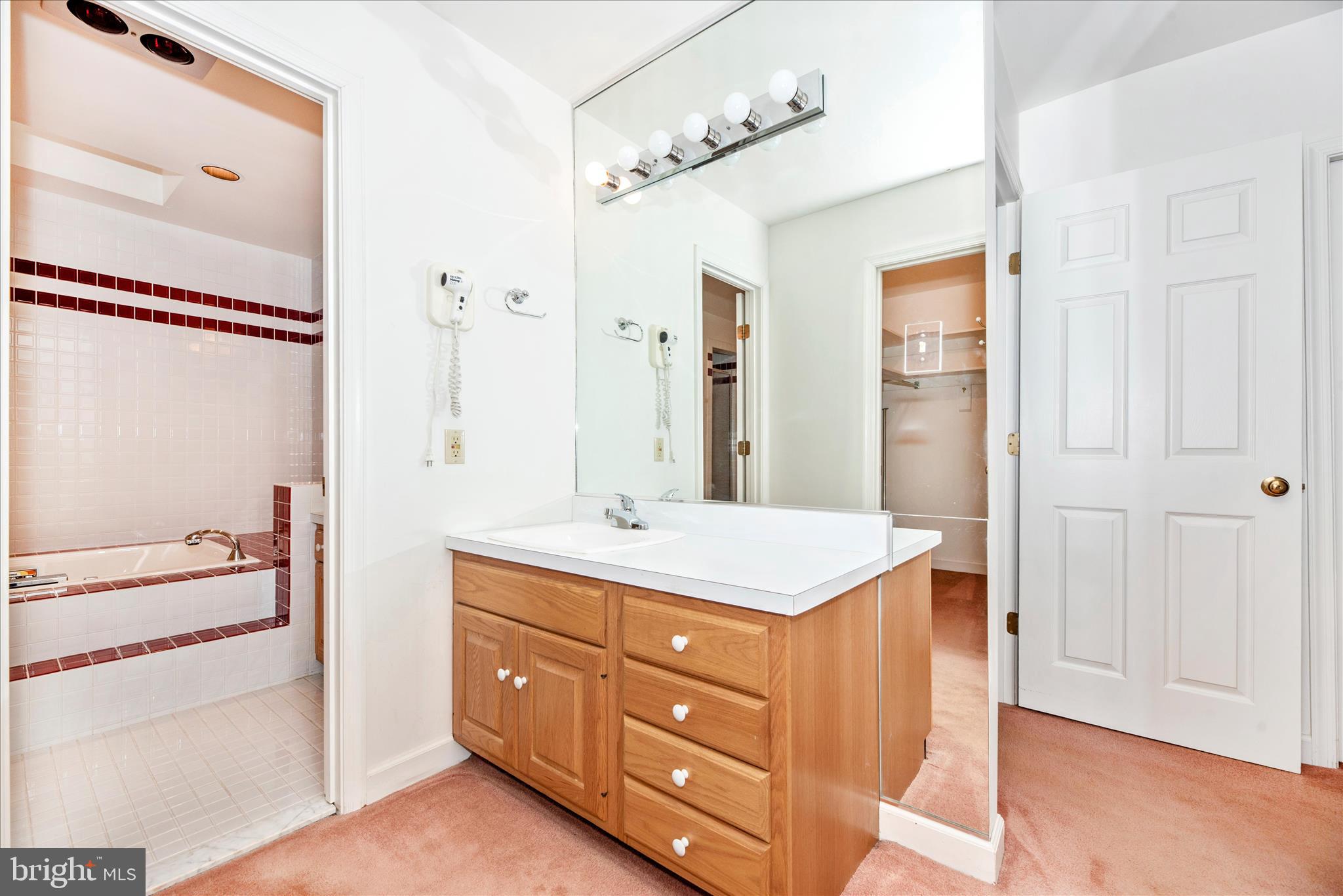 2221 Gold Mine Road Brookeville, MD 20833 - Photo 32 of 60 a bathroom with a sink a mirror and a shower