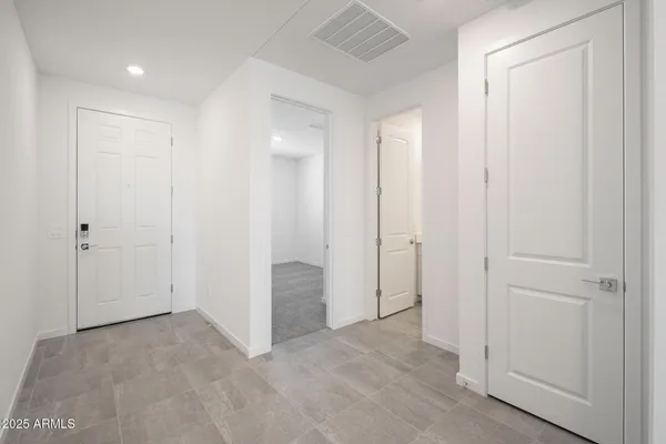 an empty room with closet area