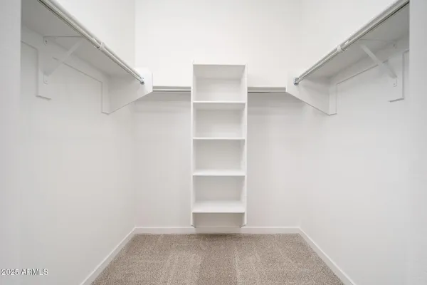 a view of an empty walk in closet