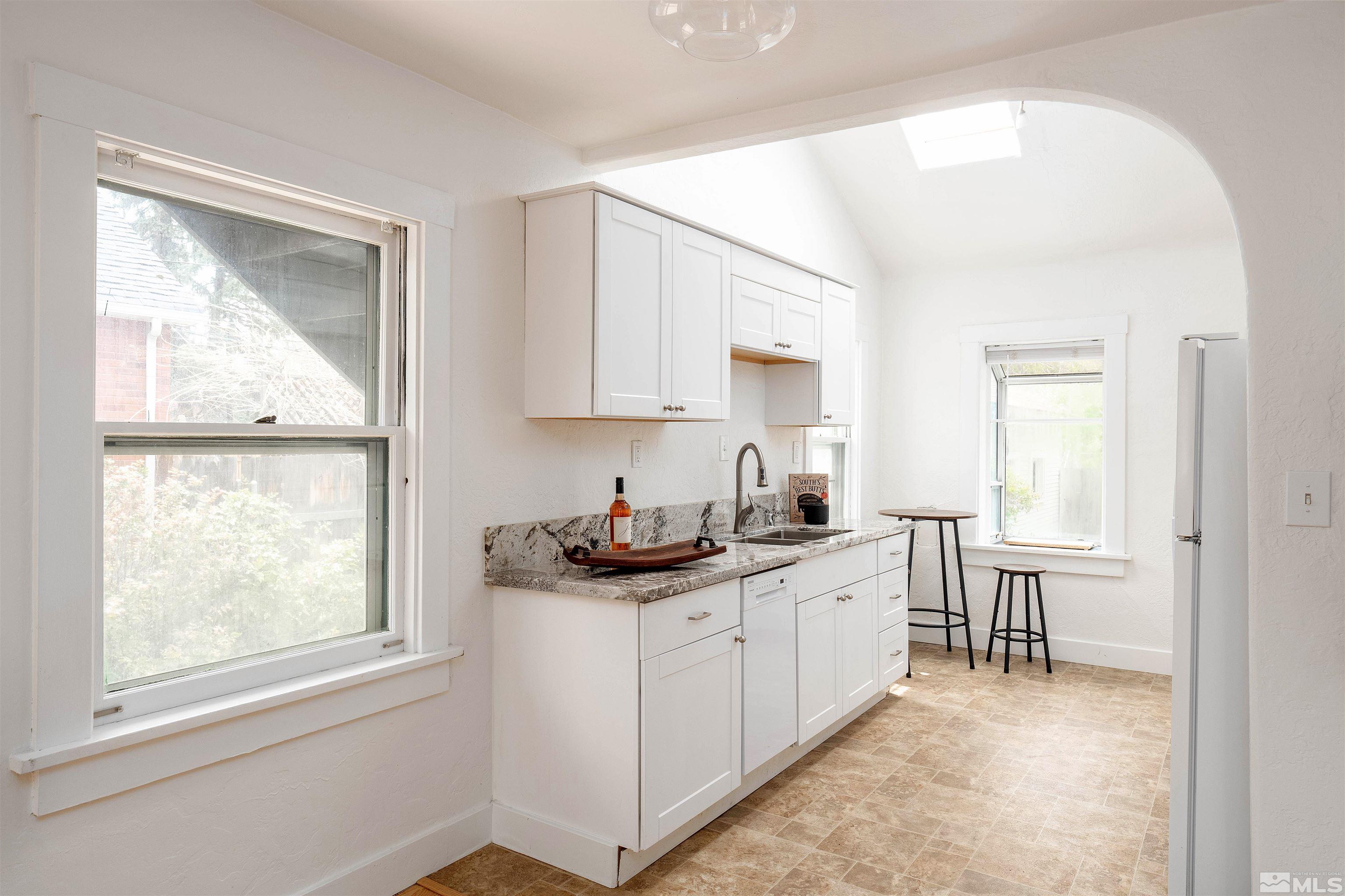 1015 Gordon Avenue Reno, NV 89509 - Photo 8 of 29 a kitchen with a sink and cabinets