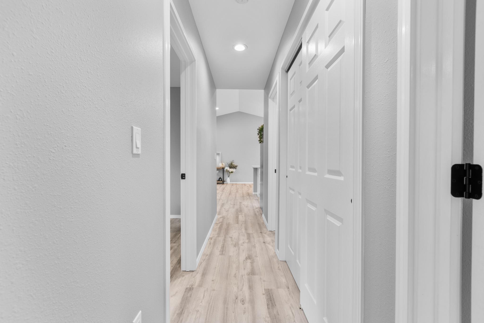 11-3343 Volcano Road Volcano, HI 96785 - Photo 25 of 30 a view of a hallway with wooden floor and staircase