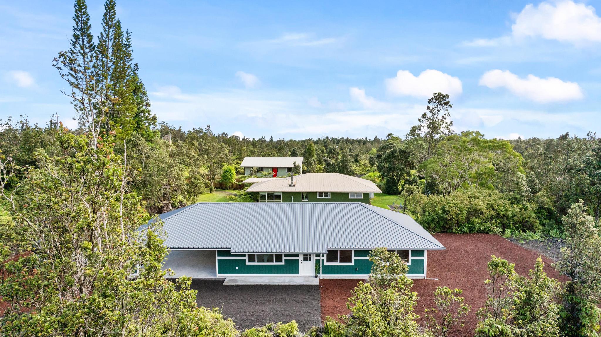 11-3343 Volcano Road Volcano, HI 96785 - Photo 3 of 30 an aerial view of a house with yard and mountain view in back