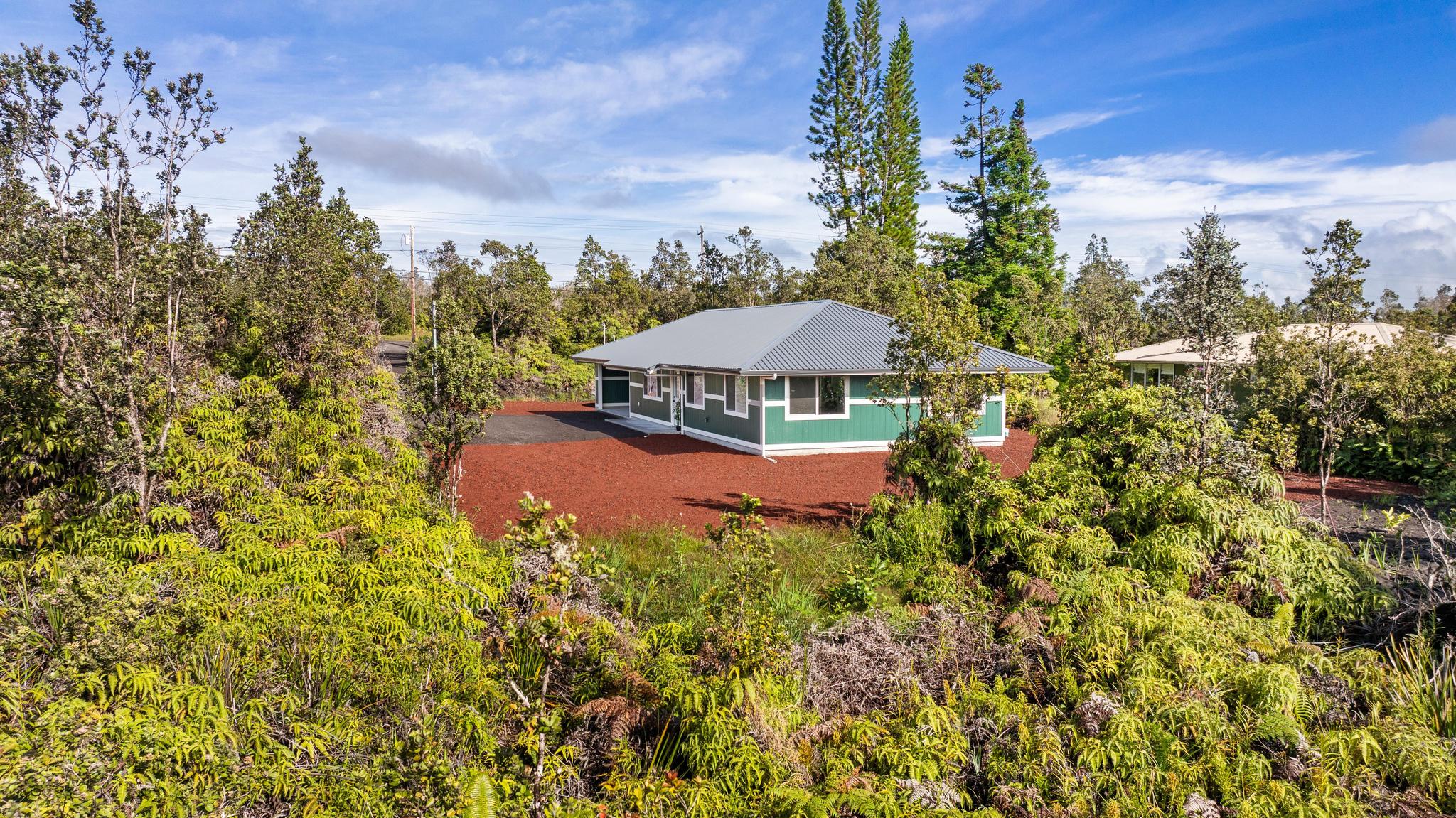 11-3343 Volcano Road Volcano, HI 96785 - Photo 4 of 30 a view of a swimming pool with an outdoor seating and a garden