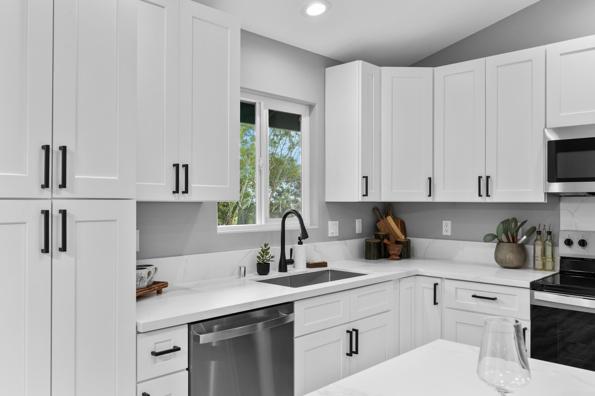 11-3343 Volcano Road Volcano, HI 96785 - Photo 8 of 30 a kitchen with white cabinets sink and white appliances
