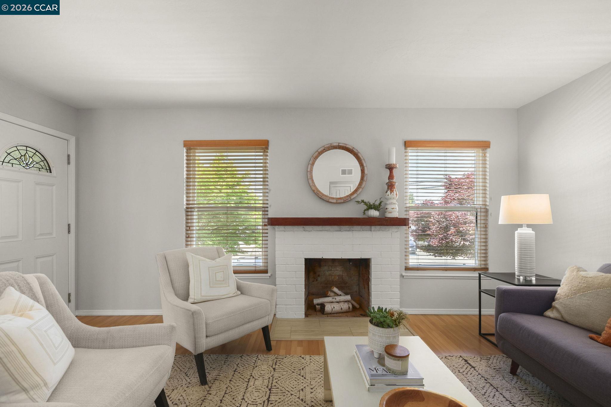 4311 Cowell Road Concord, CA 94521 - Photo 9 of 29 a living room with furniture a window and a fireplace