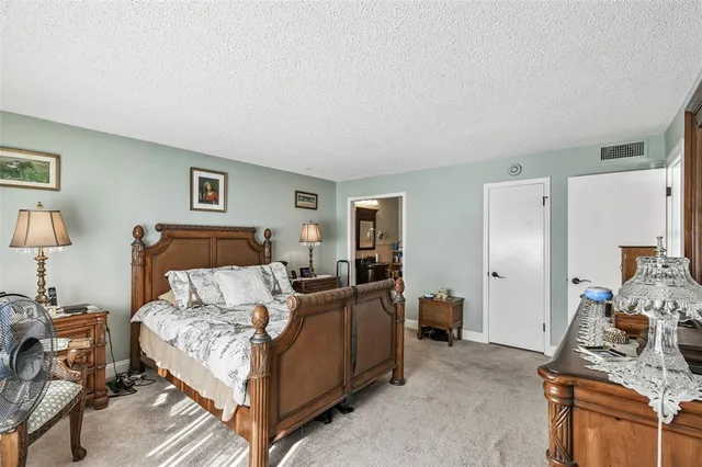 a bedroom with bed and a window