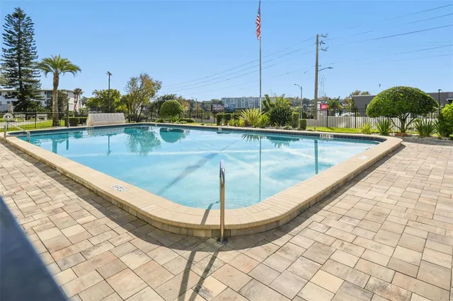 a view of a swimming pool with a sitting space