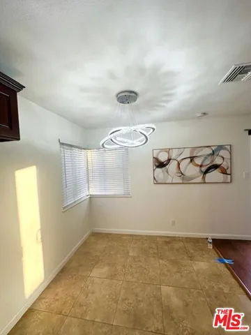 a kitchen with granite countertop a sink a counter top space appliances and cabinets
