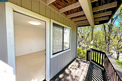 a view of a porch with wooden floor and outdoor space