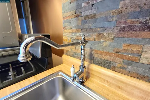 a view of a sink with a faucet