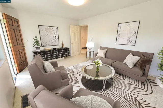 a living room with furniture and a window