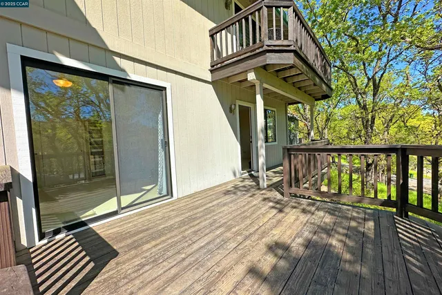a view of balcony with wooden floor