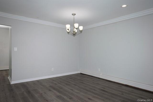 140 Sussex Place, Unit SH07 Bohemia, NY 11716 - Photo 6 of 11 a view of a chandelier in big room
