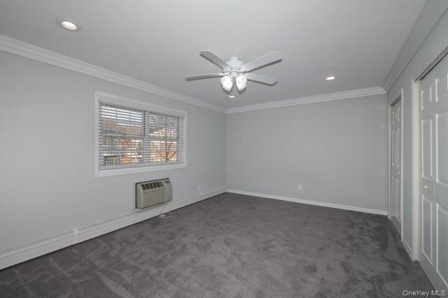 140 Sussex Place, Unit SH07 Bohemia, NY 11716 - Photo 8 of 11 an empty room with a window and a ceiling fan